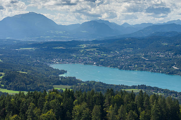 Panoramic View of Lake Worthersee Panoramic View of Lake Worthersee (Carinthia, Austria) pörtschach am wörthersee stock pictures, royalty-free photos & images