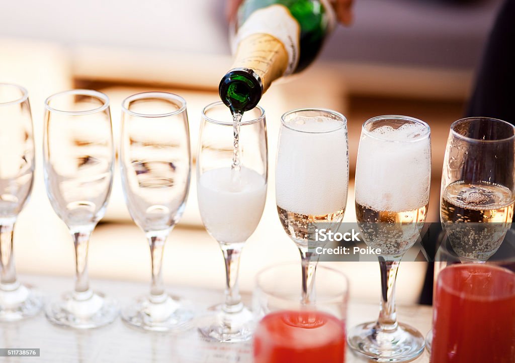 Champagne glasses Waiter serving a glass of sparkling white wine Champagne Stock Photo