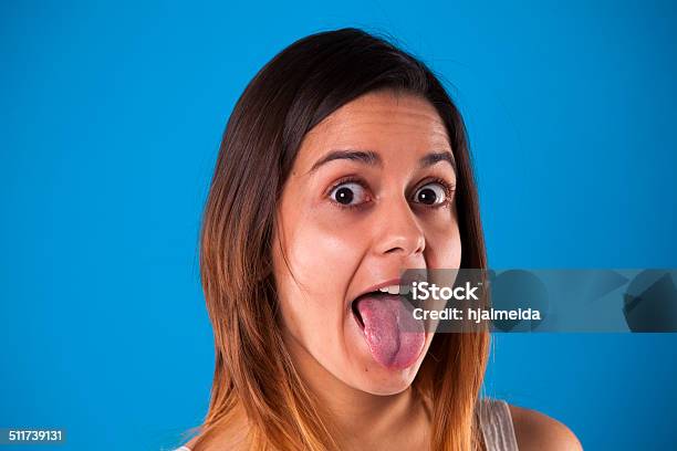 Mujer Con La Lengua Fuera Foto de stock y más banco de imágenes de Tirar de - Tirar de, Actitud, Adulto