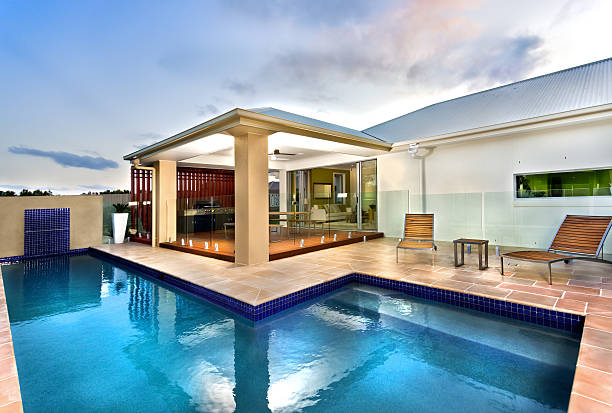 istock Luxury Hotel with blue water swimming pool in dark sky 511739568
