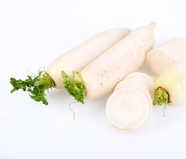 istock Daikon radishes isolated on white background 511739830