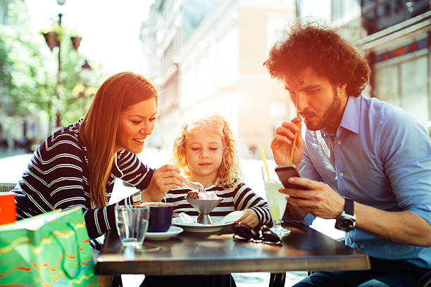 istock Father And Mother With Their Daughter in Cafe. 511741734