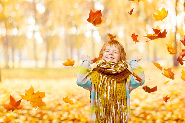istock Child Portrait, Autumn Park, Little Kid Playing Falling Yellow Leaves 511743387