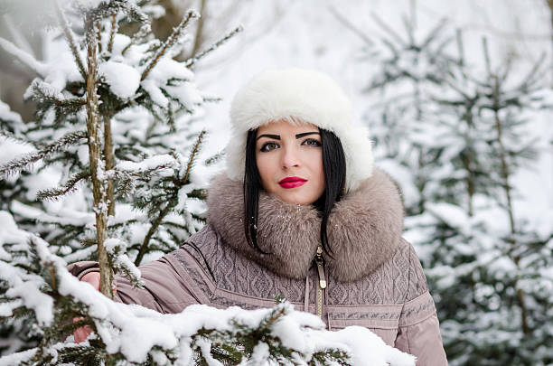 istock Beautiful woman in winter scenery in forest 511743886
