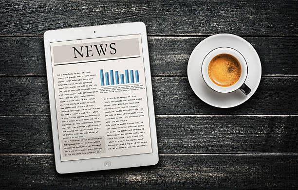 istock News article on digital tablet and coffee cup 511744273