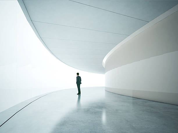istock Businessman looking at wide shining screen 511744851