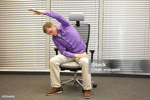 Man Exercising On Chair In Office Healthy Lifestyle Stock Photo - Download Image Now