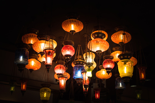 Ramadan decoration illuminated arabic lantern against blue background