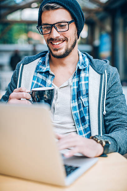 istock Man working on a laptop and having coffee 511748490