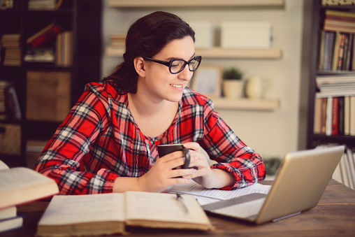 beautiful young woman working at home