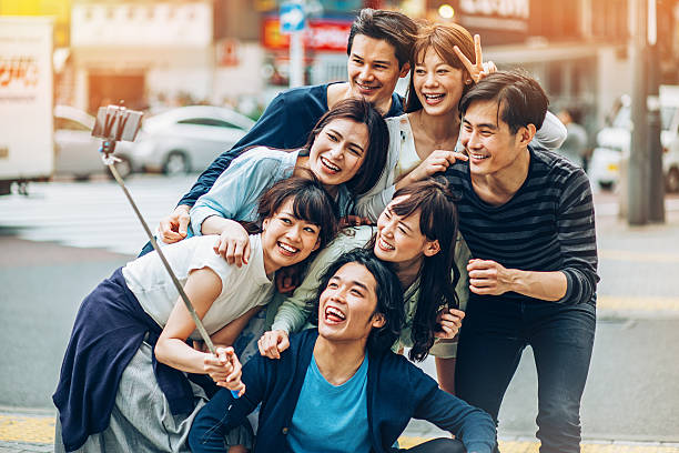 istock Group of Asian ethnicity friends making selfie 511748718