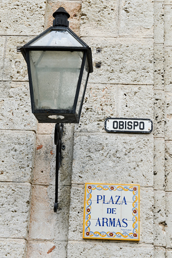 Plaza de Armas street sign and lantern in Havana, Cuba