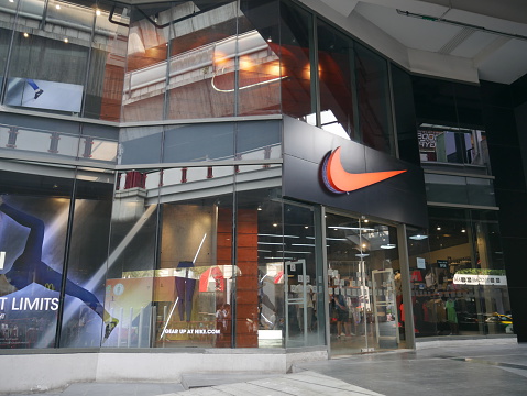 Bangkok, Thailand-February 19, 2016: Exterior view of a Nike shop in the Siam Square area of Bangkok, Thailand. People walk around the area. 