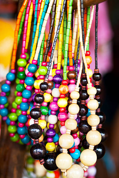 istock Colored wooden pearl necklaces 511750142