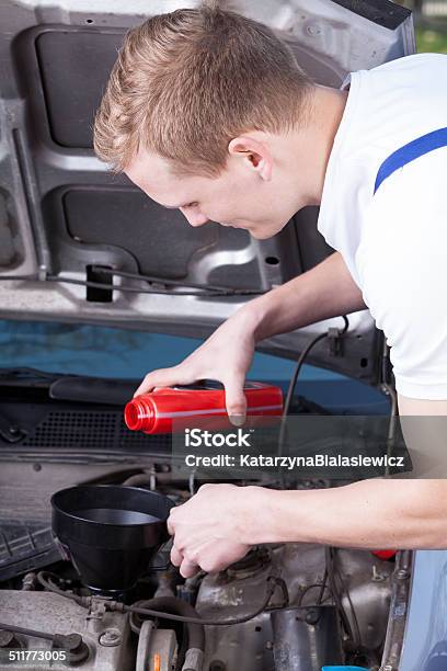 Mechanic Changing Car Oil Stock Photo - Download Image Now - Bottle, Car, Change