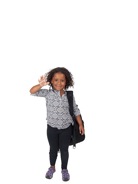 Little Ghanaian - Canadian school girl, waving stock photo