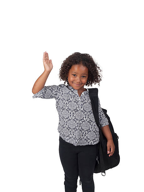 Little Ghanaian - Canadian school girl, waving stock photo