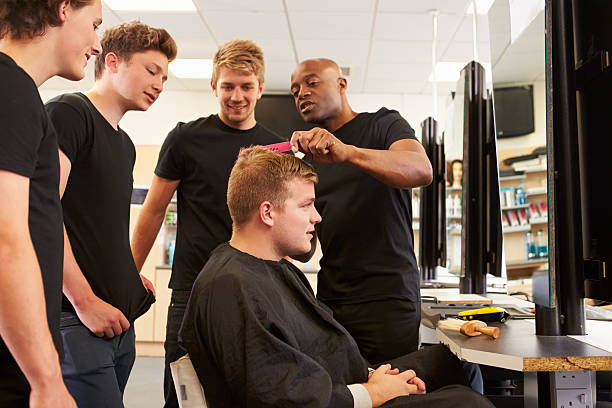 istock Teacher Helping Students Training To Become Hairdressers 511776979