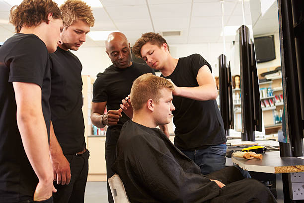 istock Teacher Helping Students Training To Become Hairdressers 511776995