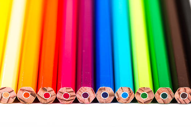 different colored pencils on white background stock photo