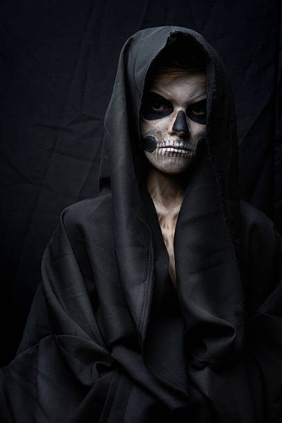 istock teenager with makeup skull cape 511777863