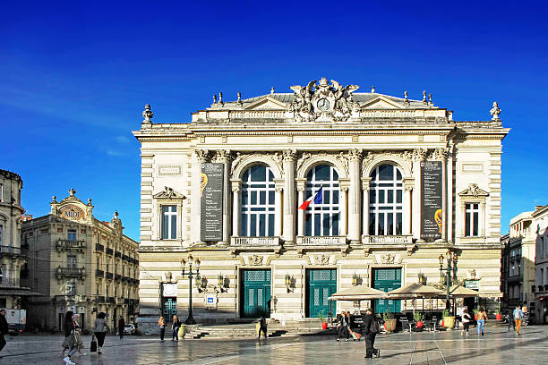 Place de la Comedie - Theater Square of Montpellier Montpellier, France - May 27, 2014: Playbilles on the facade of the National Opera theater in Montpellier, south of France. nostradamus stock pictures, royalty-free photos & images