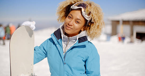 istock Gorgeous trendy young woman with her snowboard 511782762