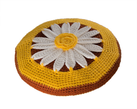 Knitting cover for a stool.