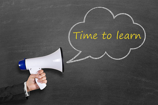istock Hand holding megaphone with Time to Learn announcement 511786042