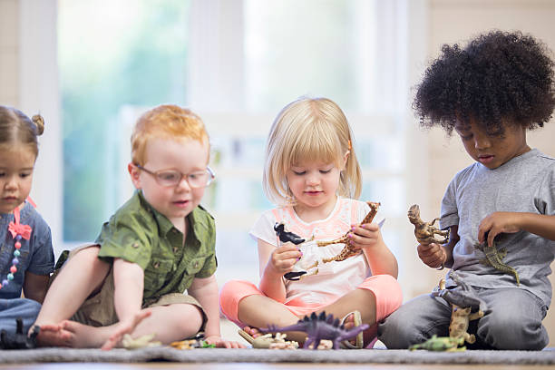 istock Children Playing with Toy Animals 511787438