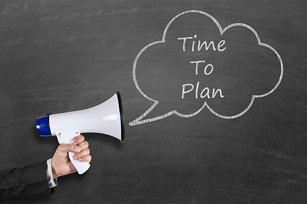 istock Hand holding megaphone with Time To Plan announcement 511787804