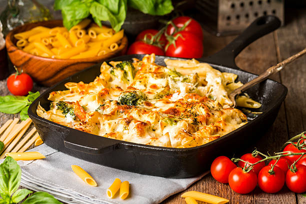istock Baked pasta with broccoli, cauliflower, cheese and bechamel sauc 511788596