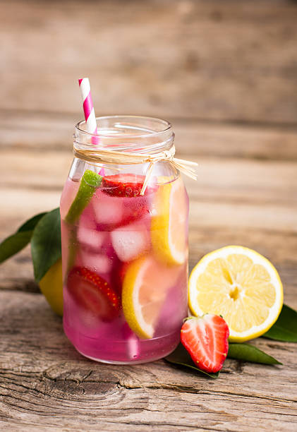 istock Homemade fresh pink lemonade with lemon, lime and strawberries 511789340