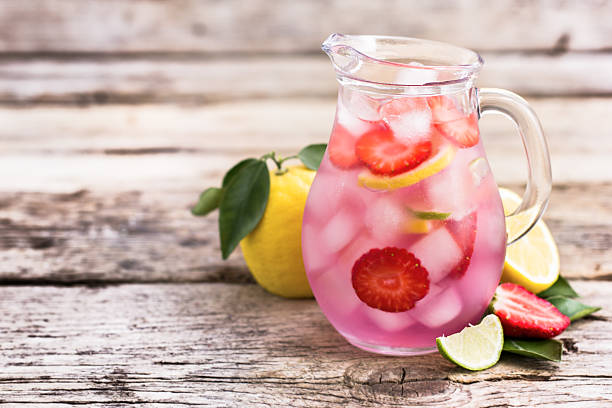 istock Homemade fresh pink lemonade with lemon, lime and strawberries 511789726