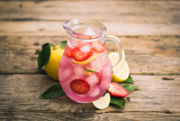 istock Homemade fresh pink lemonade with lemon, lime and strawberries 511789824