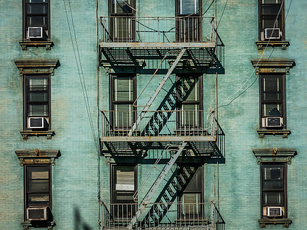 View of fire escape outside green New York apartment stock photo