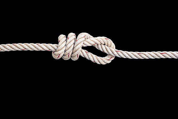 istock jute rope with knot isolated on black background 511791436
