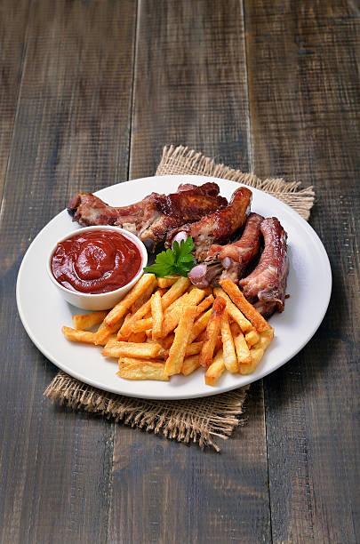 istock Fries potato, pork ribs and tomato sauce 511791832