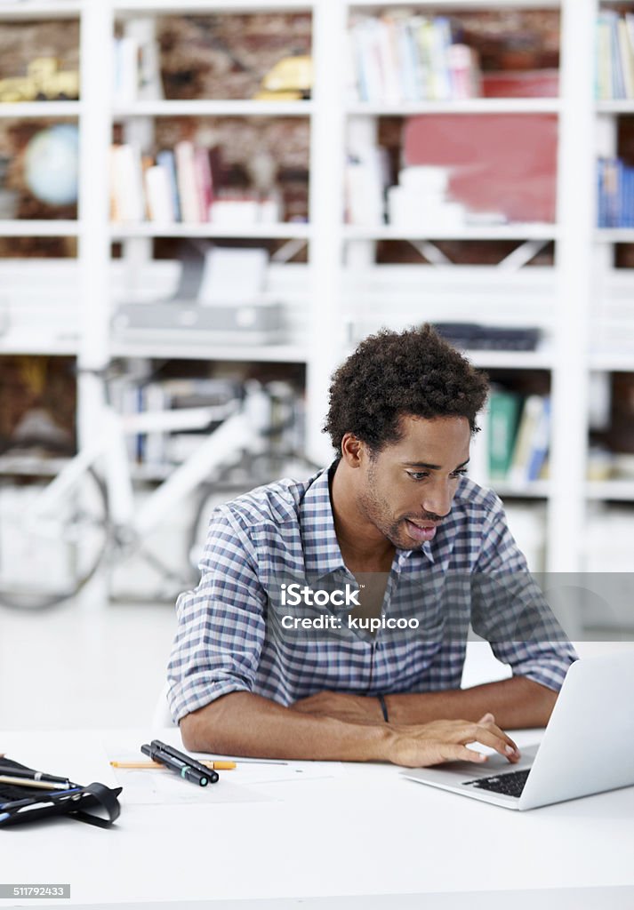 Making plans A handsome creative african american designer working at his desk Adult Stock Photo