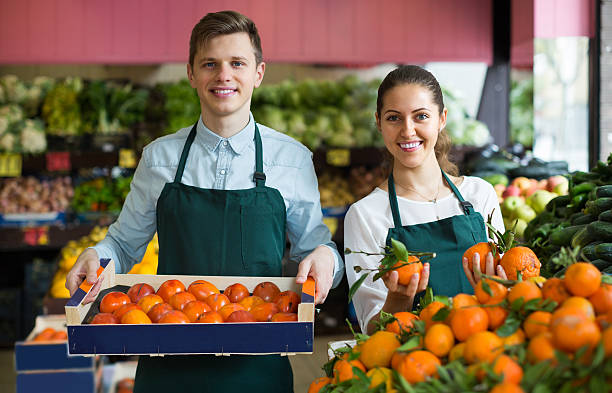 istock Stuff in apron selling sweet oranges, lemons and tangerines 511792854