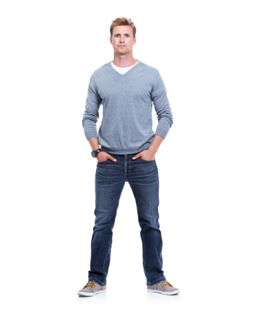 Studio shot of a handsome man isolated on white with his hands in his pockets