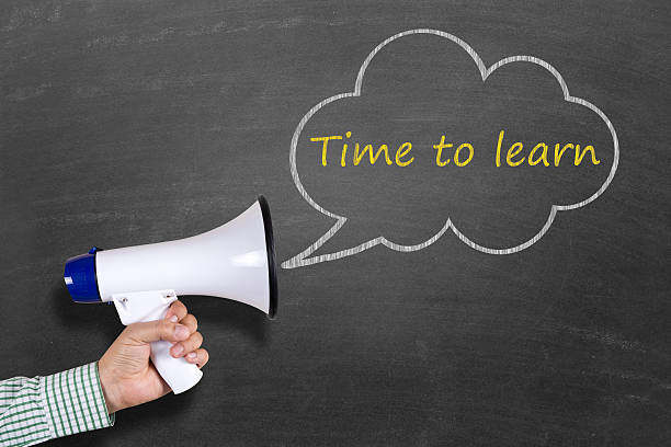 istock Hand holding megaphone with Time to Learn announcement 511793392
