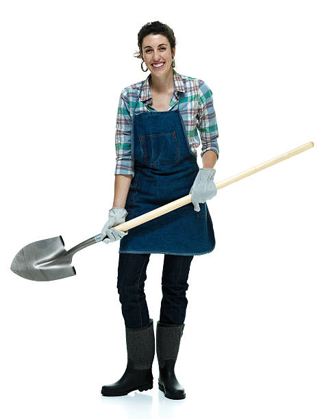 istock Happy female gardener standing with shovel 511793739
