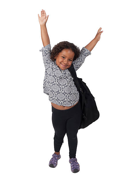 Little Ghanaian - Canadian school girl, Hands in the air stock photo