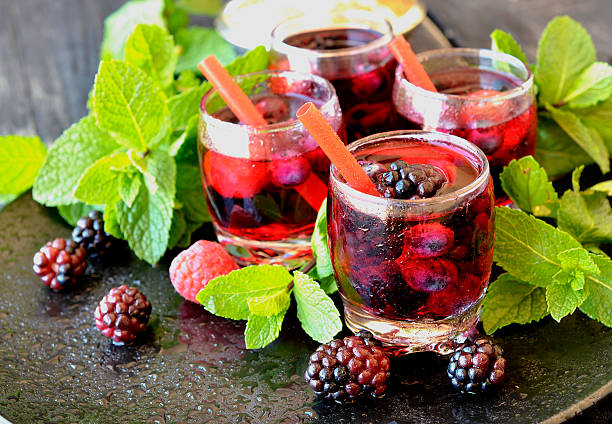 istock berry juice in a glass with berries, selective focus 511795562