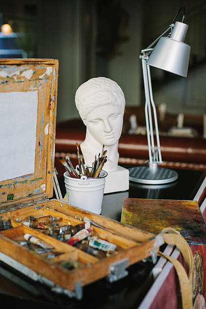 Box easel with canvas, paint,  tools of an artist