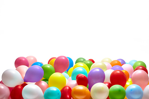 Heap of colorful balloons on white background studio shot