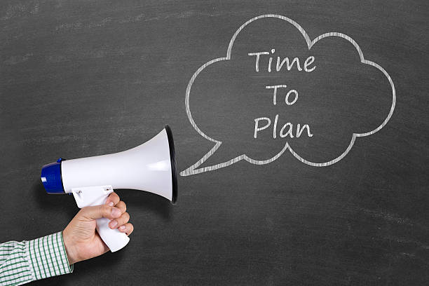 istock Hand holding megaphone with Time To Plan announcement 511796058