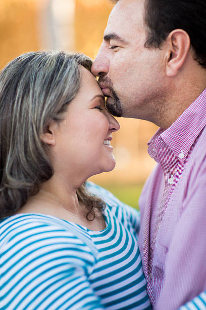istock Man kissing his wife 511798576
