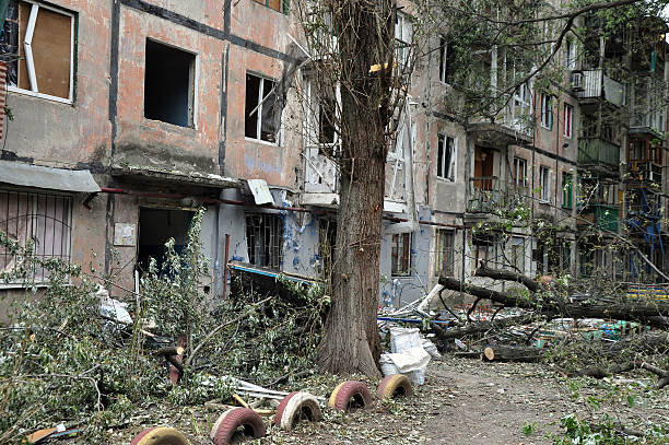 Residential building in a war zone in Ukraine. Donetsk region The destruction of the house after the shelling in eastern Ukraine.  Donetsk region, Khartsyzsk donetsk photos stock pictures, royalty-free photos & images